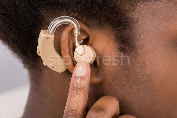 Nő visel hallókészülék fül közelkép afrikai Stock fotó © AndreyPopov