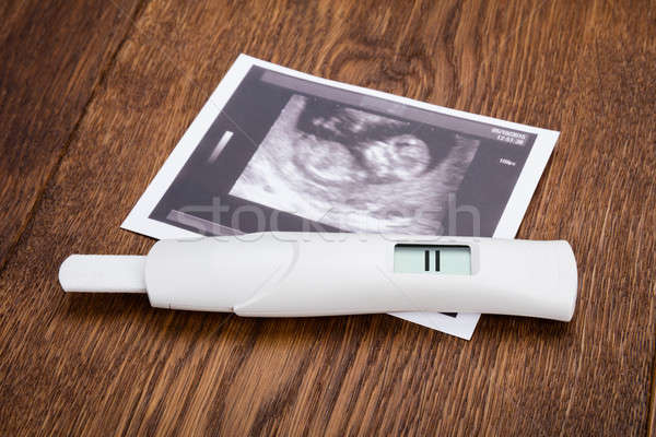 Pregnancy Kit On Wooden Desk Stock photo © AndreyPopov
