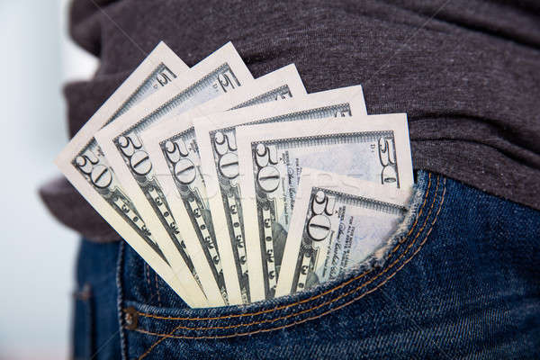 Cincuenta dólar nota jeans bolsillo primer plano Foto stock © AndreyPopov