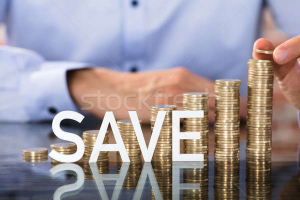 Salvar texto moedas pessoa moeda Foto stock © AndreyPopov