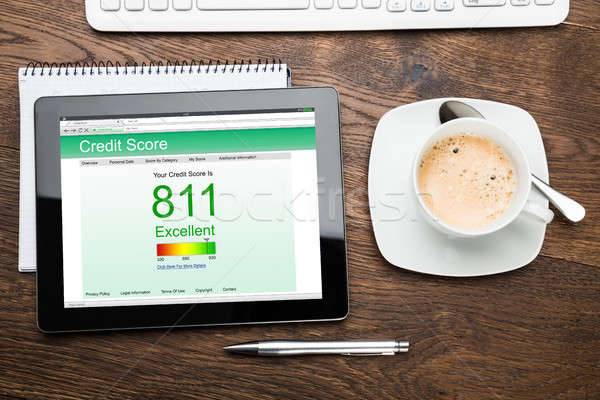 Digital Tablet Showing Credit Score At Desk Stock photo © AndreyPopov