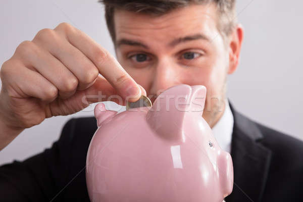 Stockfoto: Zakenman · munt · spaarpot · roze · geld