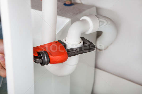 Plumber Fixing Sink In Kitchen Stock photo © AndreyPopov