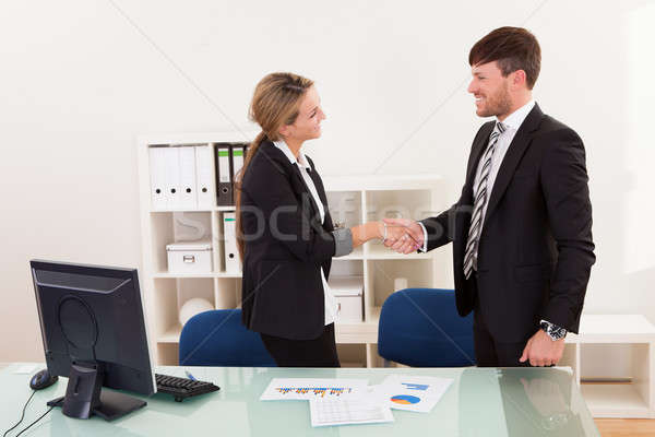 Business man and woman shaking hands Stock photo © AndreyPopov