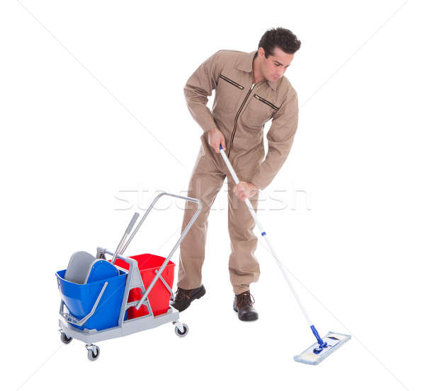 Male Sweeper Cleaning Floor Stock photo © AndreyPopov