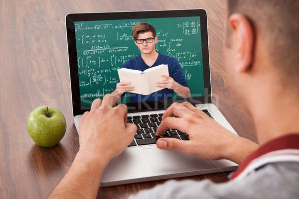 Estudante on-line matemática palestra laptop masculino Foto stock © AndreyPopov