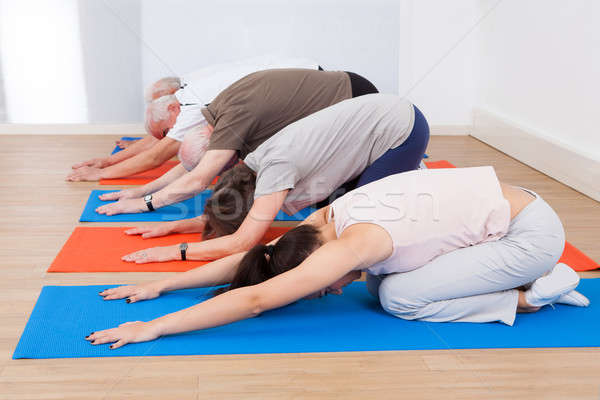 Insanlar yoga spor salonu egzersiz Stok fotoğraf © AndreyPopov