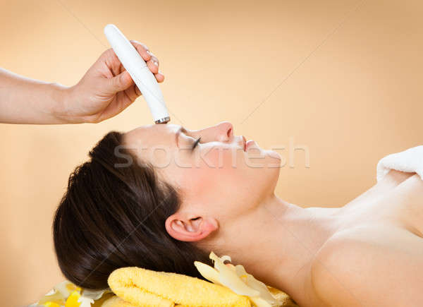 Woman Receiving Microdermabrasion Therapy On Forehead At Spa Stock photo © AndreyPopov