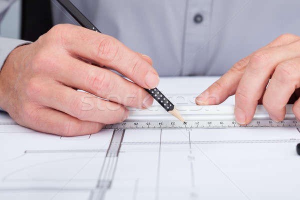 Architect Drawing On Blueprint Stock photo © AndreyPopov