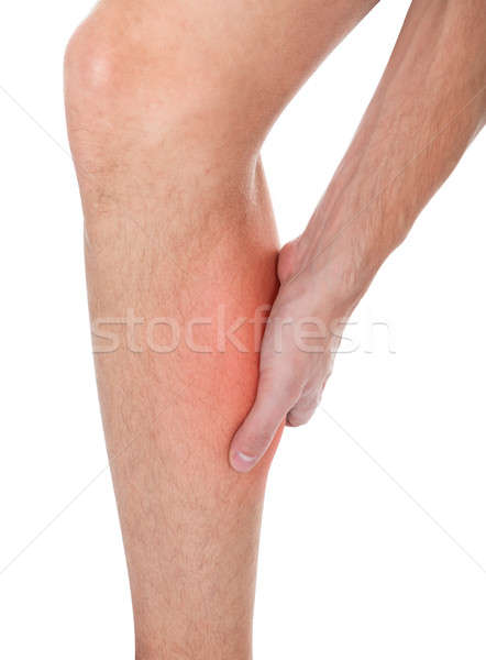 Hombre pierna lesión primer plano sufrimiento blanco Foto stock © AndreyPopov