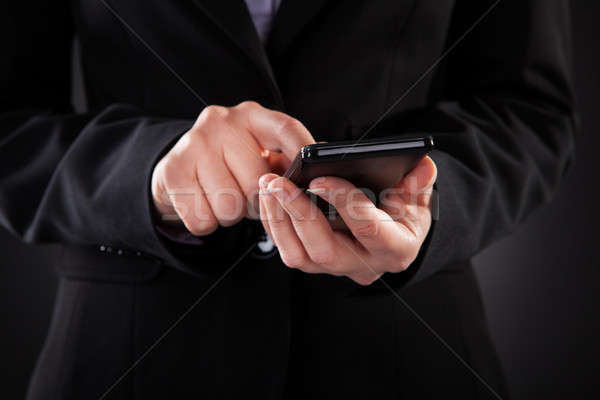 Businessperson Holding Cellphone Stock photo © AndreyPopov