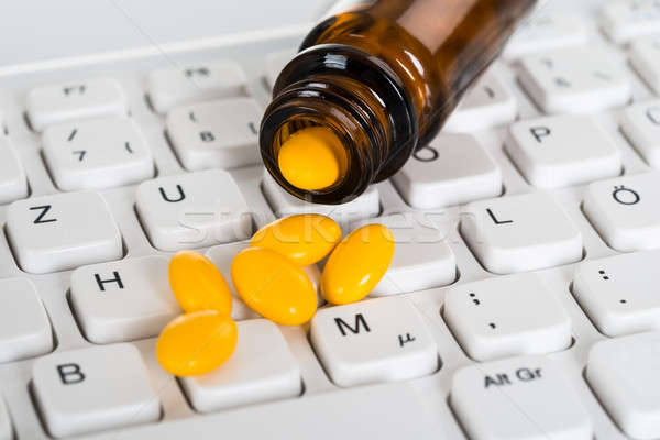 Pills Spilled From Bottle Stock photo © AndreyPopov