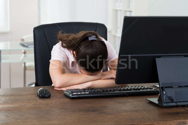 Businesswoman Sleeping On Desk Stock photo © AndreyPopov