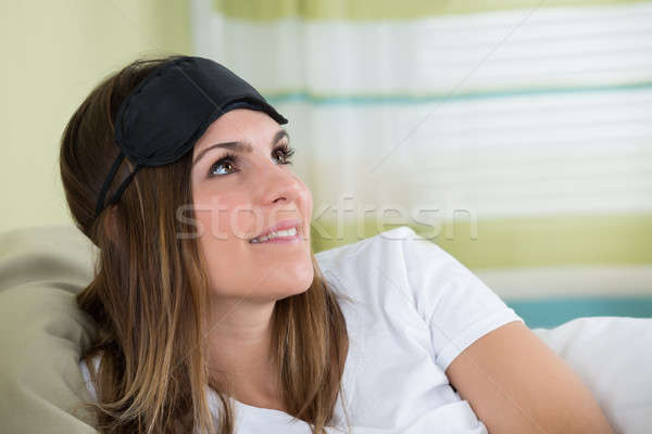 Contemplating Young Woman With An Eye Mask Stock photo © AndreyPopov