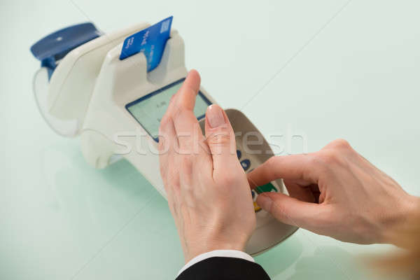 Woman Hand Using Credit Card Machine Stock photo © AndreyPopov