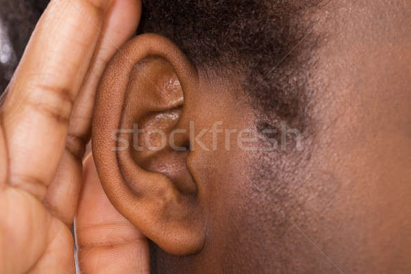 Woman Trying To Hear With Hand Over Ear Stock photo © AndreyPopov