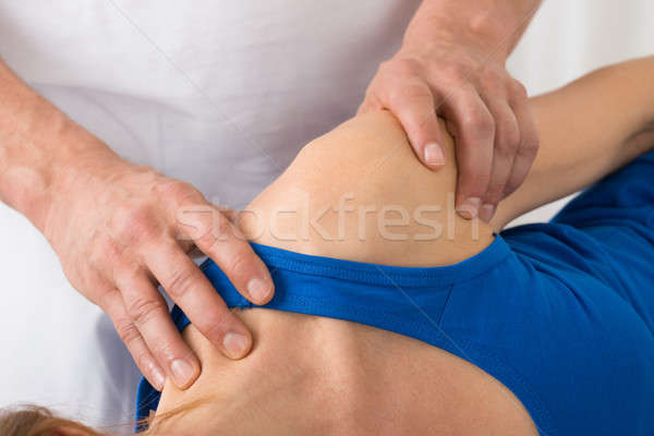 Person Giving Massage To Woman In Spa Stock photo © AndreyPopov