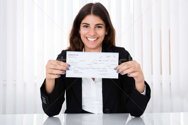 Réussi femme d'affaires chèque bureau bureau [[stock_photo]] © AndreyPopov