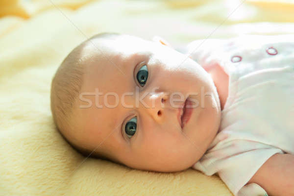 Stock photo: An Innocent Child On Yellow Blanket