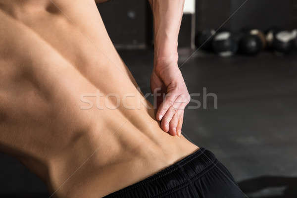 Homme torse nu permanent gymnase [[stock_photo]] © AndreyPopov