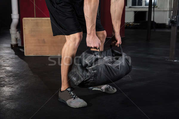 Homem trabalhando fitness saco jovem Foto stock © AndreyPopov