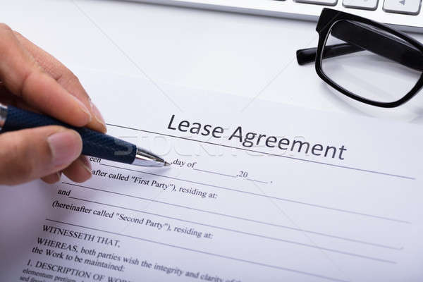 Person Filling Lease Agreement Form Stock photo © AndreyPopov
