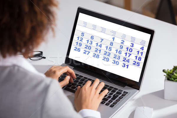 Geschäftsfrau schauen Kalender täglich Tagesordnung Stock foto © AndreyPopov