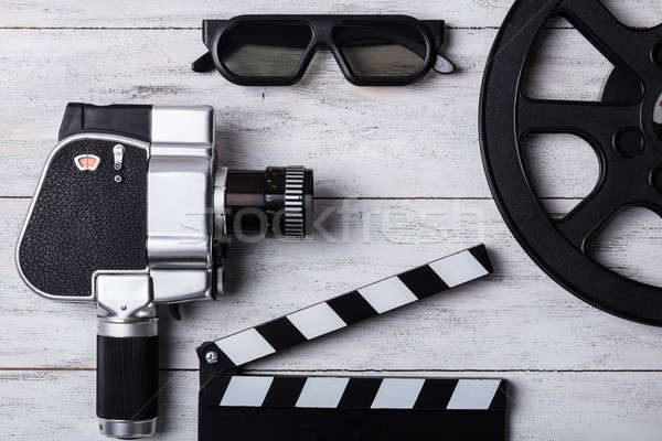 Stock photo: Elevated View Of Movie Camera, Film Reel And Clapper Board