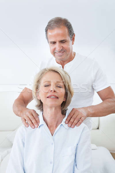 Man Massaging Woman's Shoulder Stock photo © AndreyPopov
