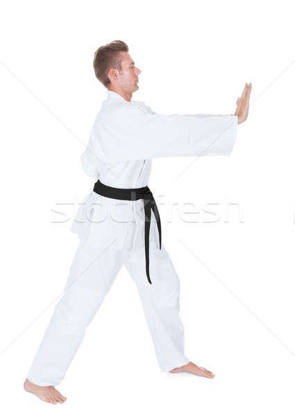 Stock photo: Young Man Practicing Karate