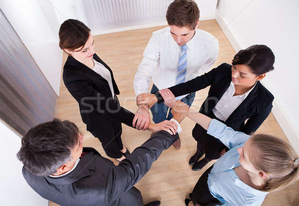 Group Of Businesspeople Holding Wrist Stock photo © AndreyPopov