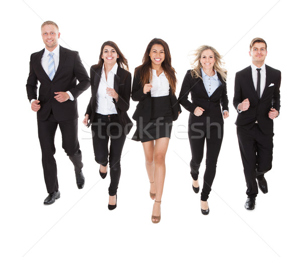 Portrait Of Welldressed Businesspeople Running Stock photo © AndreyPopov