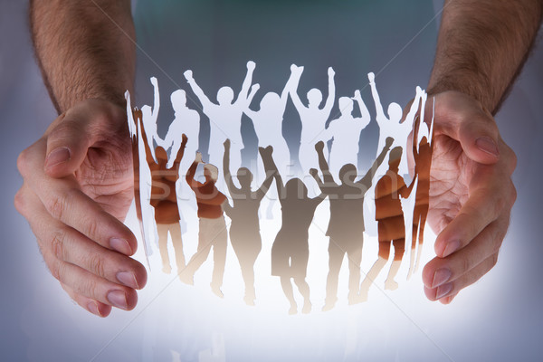 Hands With People Cut Out Of Paper Stock photo © AndreyPopov