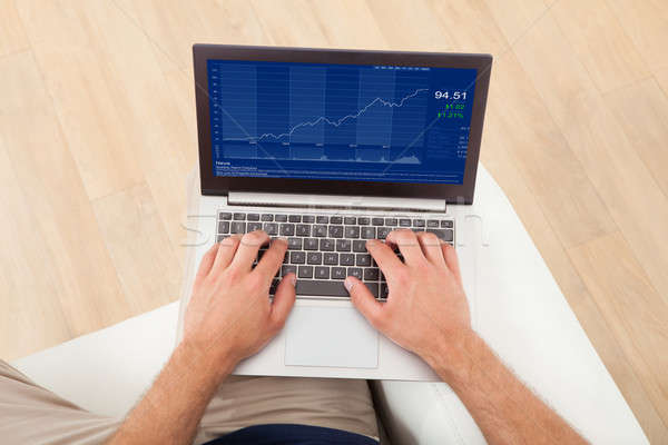 бизнесмен используя ноутбук домой изображение графа ноутбука Сток-фото © AndreyPopov