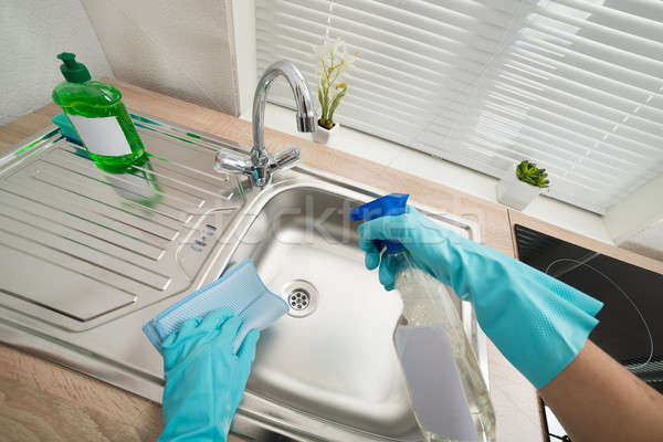 Person Hands Cleaning Kitchen Sink Stock photo © AndreyPopov