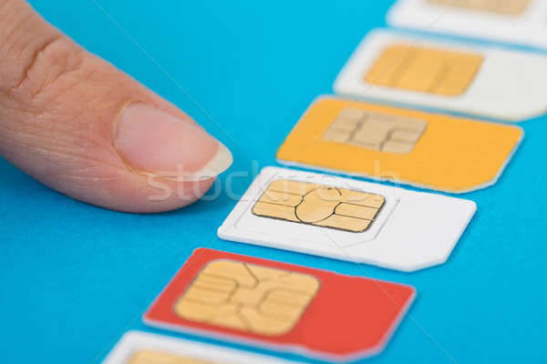 Person Hand Selecting Sim Card Stock photo © AndreyPopov