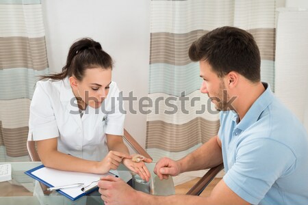 Doctor Injecting Injection To Patient Stock photo © AndreyPopov
