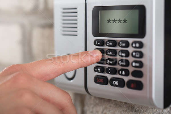 Human Hand Entering Security System Code Stock photo © AndreyPopov