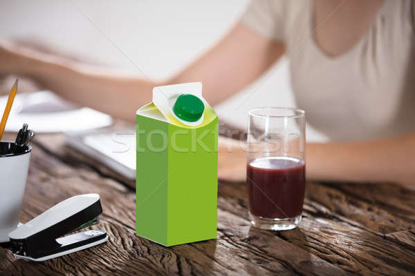 Carton verre jus bureau paquet table en bois [[stock_photo]] © AndreyPopov