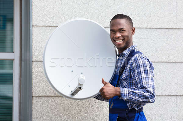 happy male technician with tv satellite dish stock photo andriy dish technician