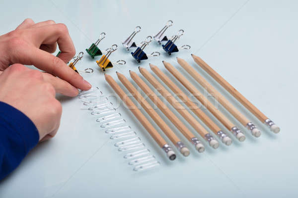 Human Hand Arranging Office Supplies Stock photo © AndreyPopov