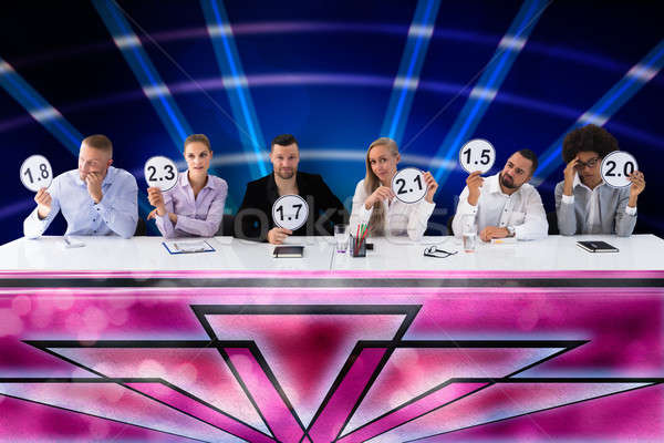 Group Of Upset Judges Giving Scores Stock photo © AndreyPopov