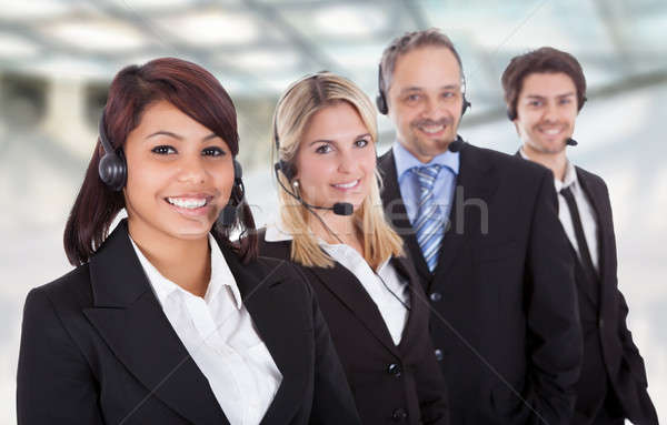 Portret gelukkig business team hoofdtelefoon permanente lijn Stockfoto © AndreyPopov