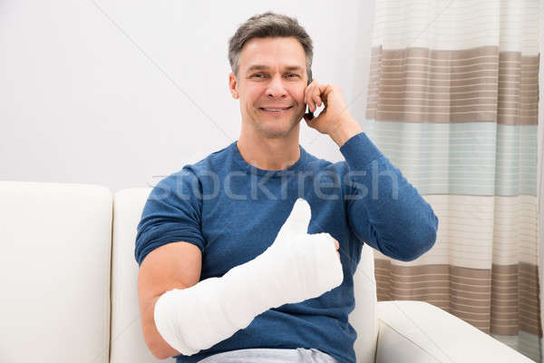 Disabled Man Talking On Cellphone Stock photo © AndreyPopov