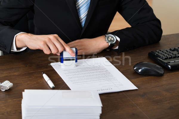 Businessman Stamping Contract Paper Stock photo © AndreyPopov