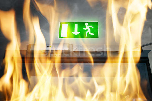 Fire Burning Near An Emergency Exit Door Stock photo © AndreyPopov