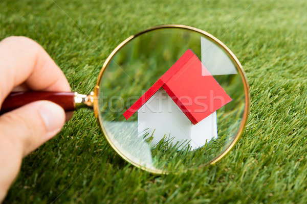 Magnifying Glass Inspecting A Model House Stock photo © AndreyPopov