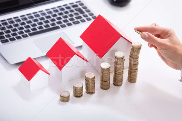 Businessperson's Hand Stacking Coins Stock photo © AndreyPopov