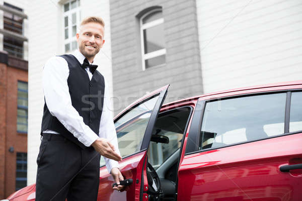 Male Valet Opening Car Door Stock photo © AndreyPopov