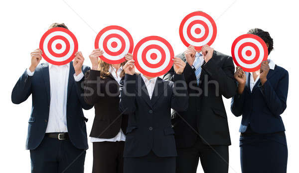 Businesspeople Holding Target Against Their Faces Stock photo © AndreyPopov